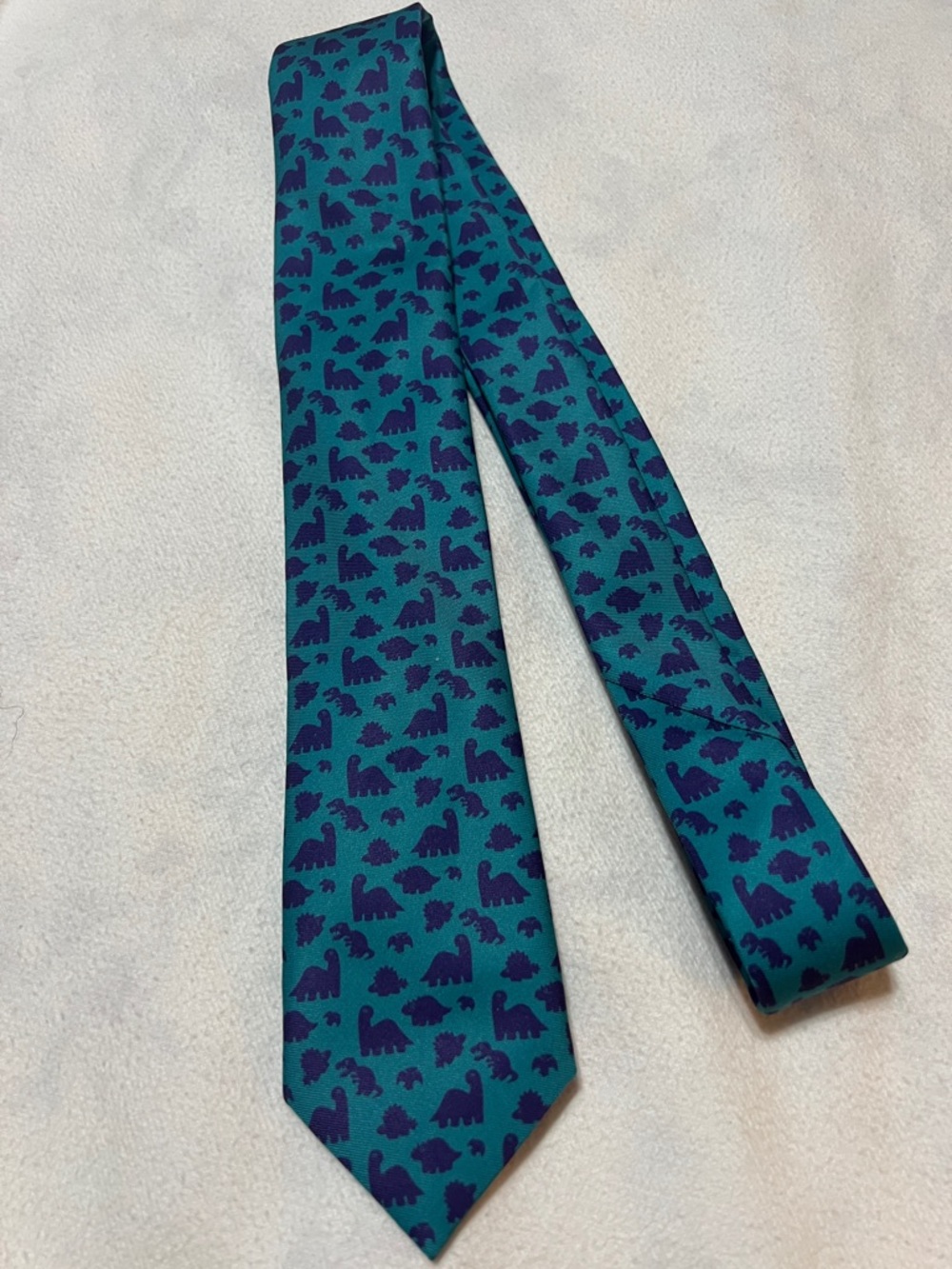 KNOTTY Teal Tie with Navy Dinosaur Pattern
HANDMADE IN THE USA